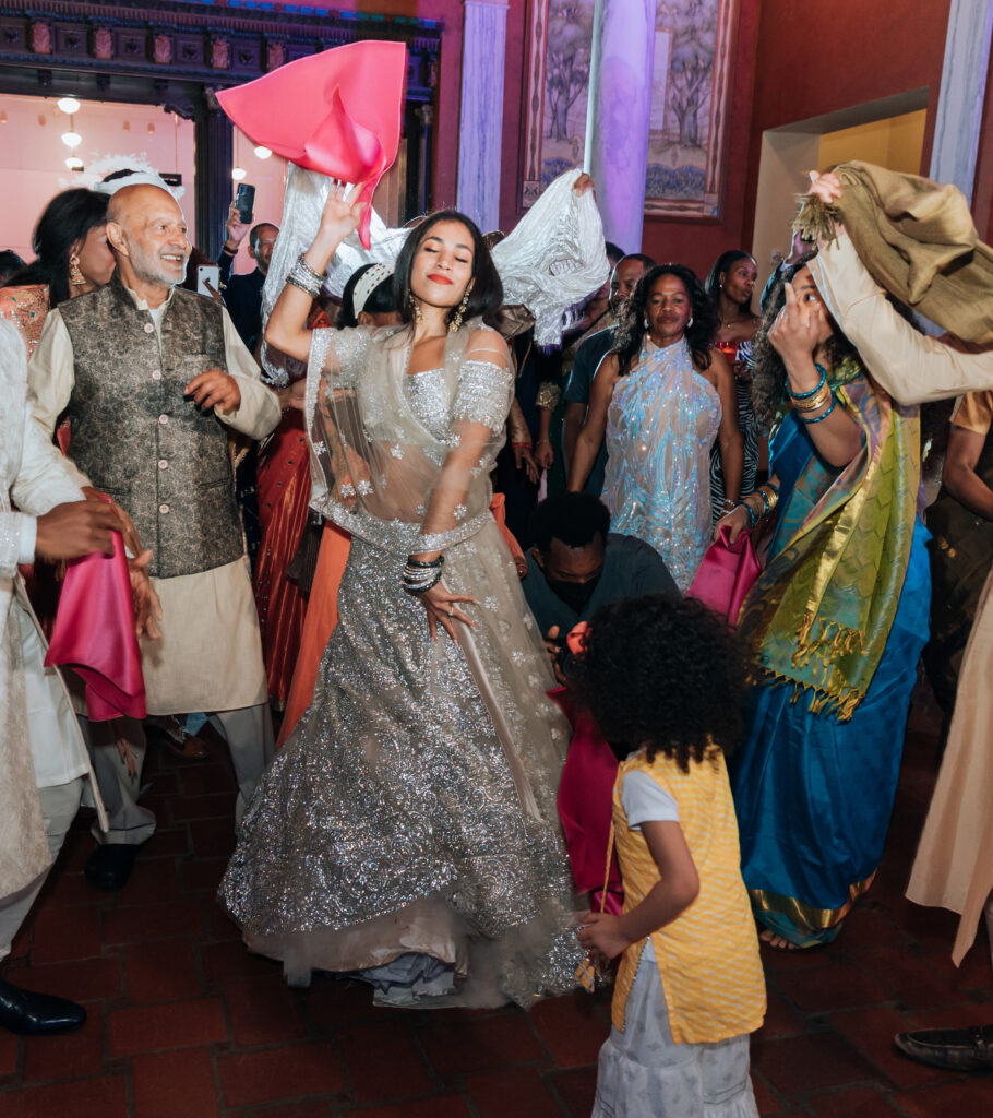 Joanna Booth Weddings captured bride dancing at Julia Eideson libraru during her Roce Cermeony in Houston Texas