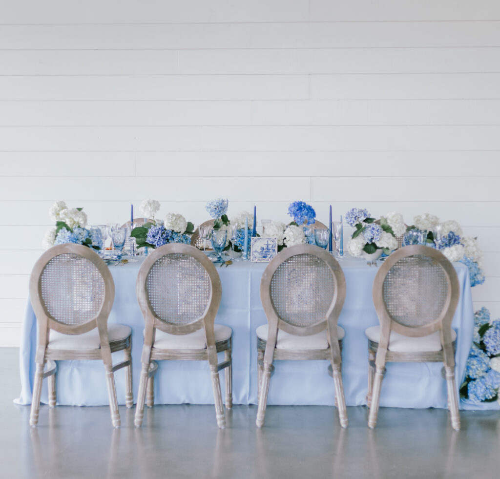 Joanna Booth Weddings captured a stunning dusty blue table scape from a styled shoot at the Briscoe Manor venue in Richmond, Texas
